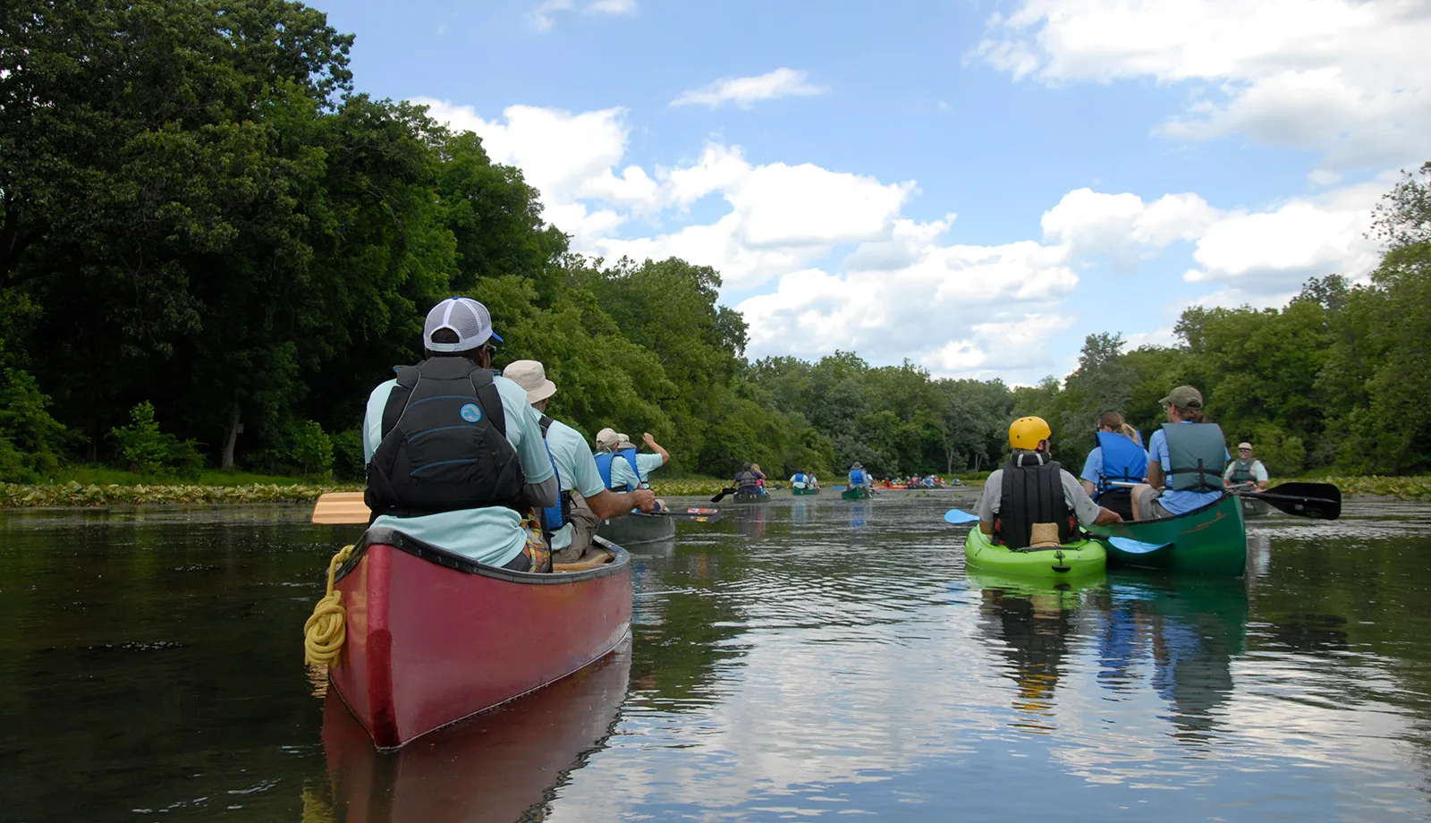 Paddlers CU from behind Metro Section